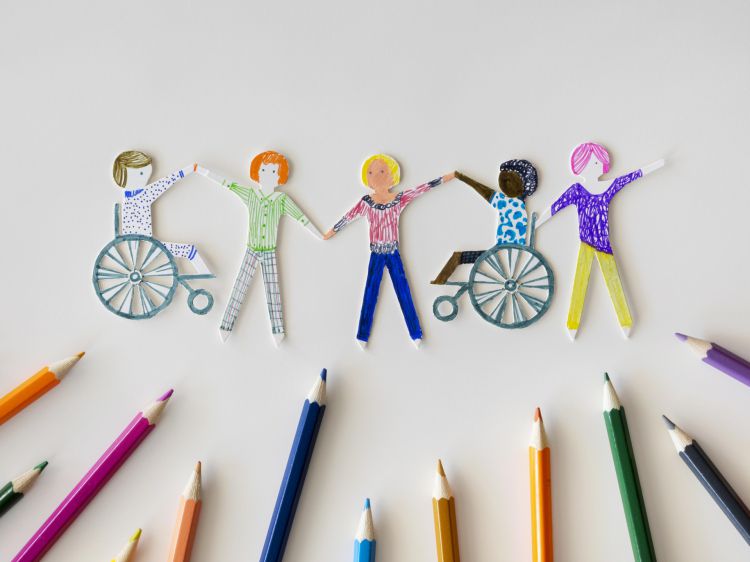 multi-ethnic-disabled-people-community-with-pencils